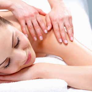 A women relaxing while having a massage